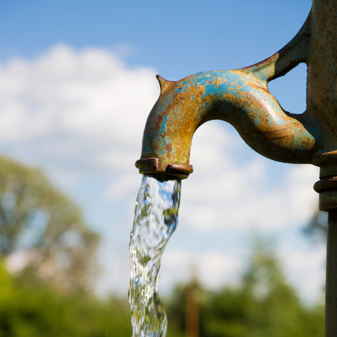 This is an image of water being pumped from a faucet outside