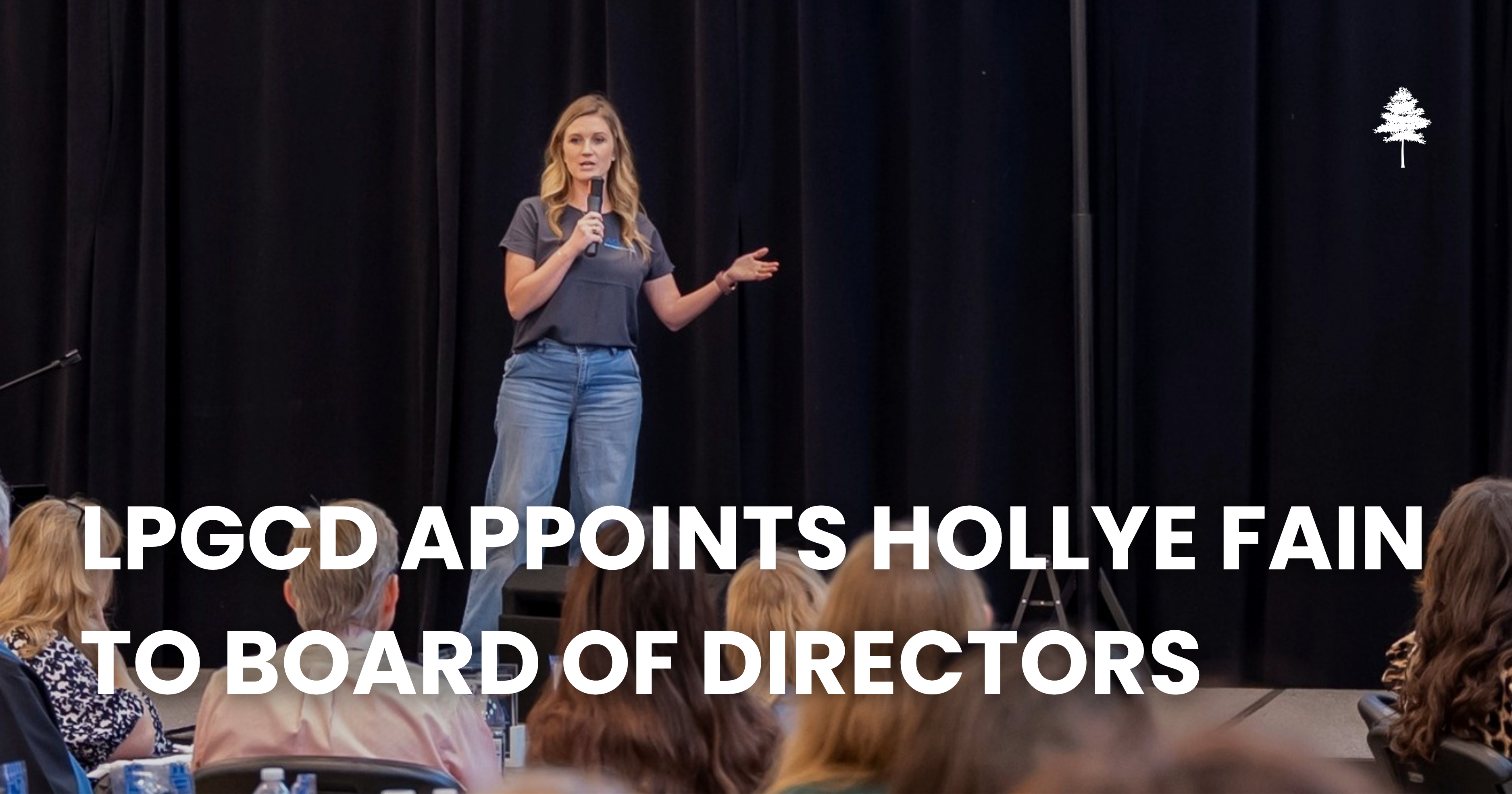 Woman speaking to an audience with text announcing Hollye Fain’s appointment to the LPGCD Board